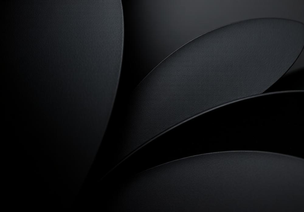 Macro detail of matte black laser-cut steel petals